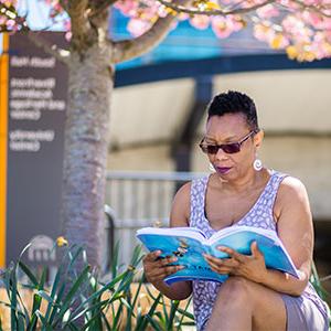 Woman studying on bench at Pottstown Campus